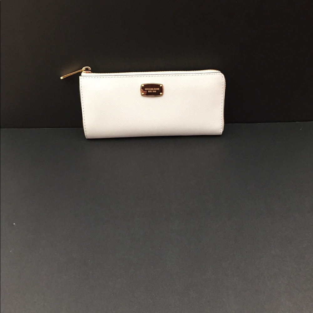 Michael Kors white wallet.